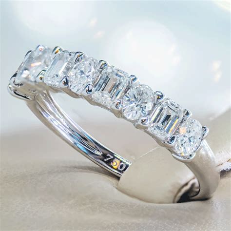 18k White Gold Band With 1 11ctw Of Oval And Emerald Cut Diamonds