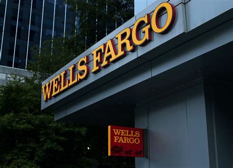 Wells Fargo profit falls on sales scandal costs, higher reserves