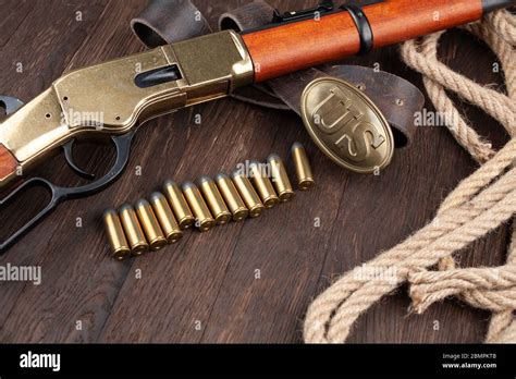 Wild west weapons and ammunition on wooden table Stock Photo - Alamy