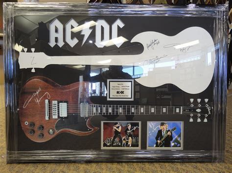 √ Ac Dc Autographed Guitar