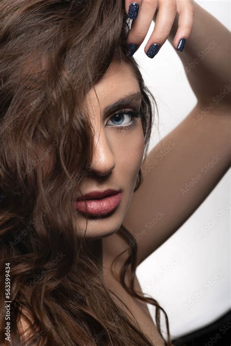Make Up And Fashion Concept Brunette Woman With Long Wavy Hair Sensual Studio Portrait Model