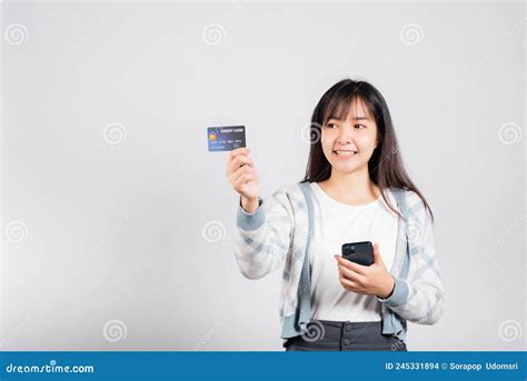 Woman Excited Smiling Hold Mobile Phone And Plastic Debit Credit Bank