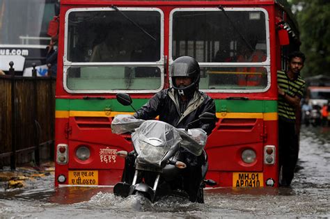 Heavy Rains Batter Indias Mumbai Disrupting Air Rail Traffic The