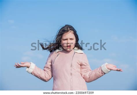 Child Confused Face Presenting Product On Stock Photo 2200697209 ...