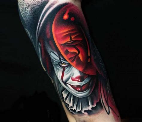 A Close Up Of A Person S Arm With A Scary Clown Tattoo On It