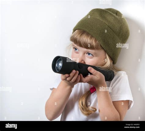 little girl playing with a flashlight Stock Photo - Alamy