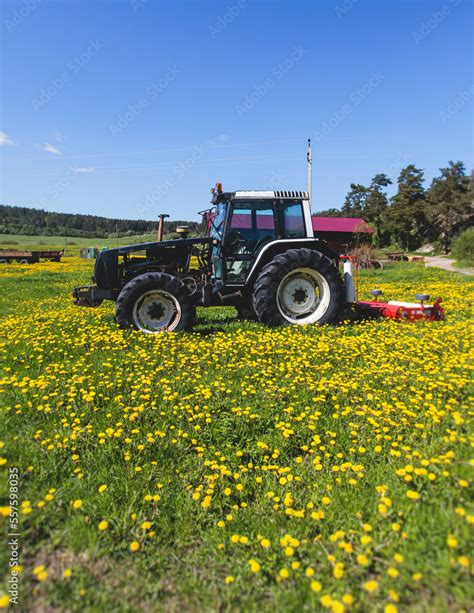 Tractor with a disc harrow system on the cultivated farm field, process ...