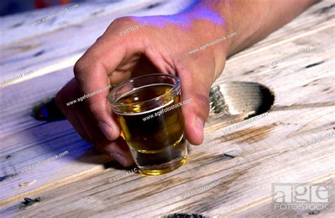 Person Holding Shot Glass Stock Photo Picture And Royalty Free Image