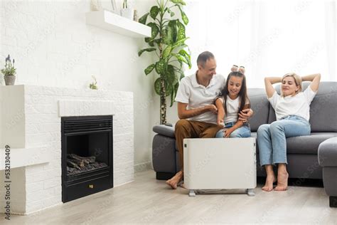 Modern electric heater on floor at home Stock Photo | Adobe Stock