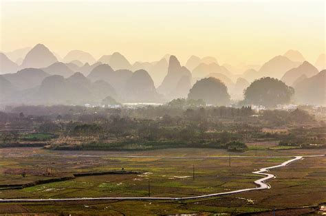 Karst mountains scenery in sunset Photograph by Carl Ning