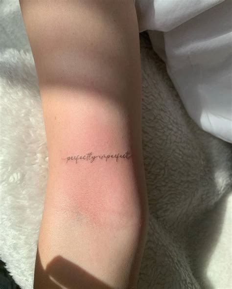 Perfectly Imperfect Lettering Tattoo On The Bicep