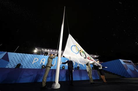 Olympic Flag Raised Upside Down At End Of Rain Soaked