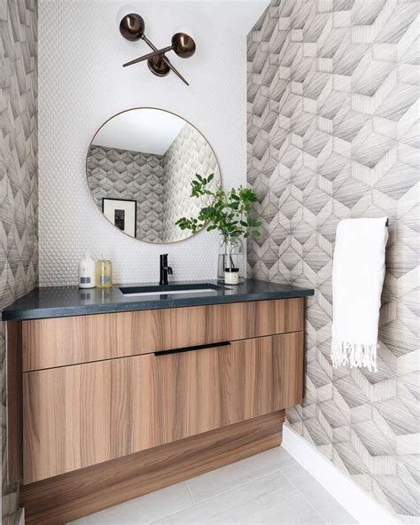 A Bathroom With A Large Mirror And Wooden Cabinet In Front Of The Counter Top Along With A Plant