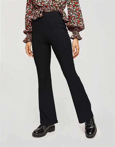 Miss Selfridge Petite ribbed flared trousers in black | ASOS