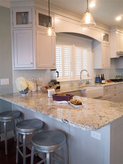 Elegant Coastal Kitchen With Granite Countertops And Porcelain