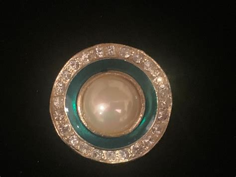 Vintage Gold Clip On Earring With Faux Pearl In The Center Surrounded