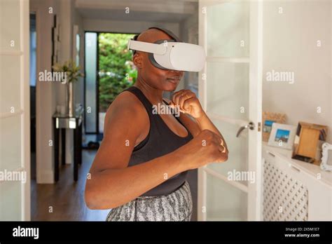 Mature Woman Practicing Boxing With Virtual Reality Simulator Stock Photo Alamy
