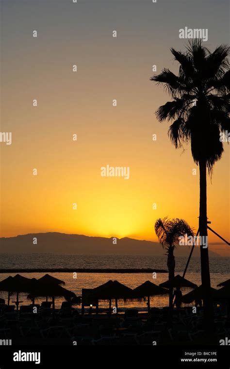 Sunset over tenerife beach Stock Photo - Alamy