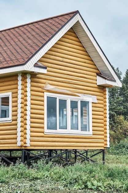 Maison En Rondins Avec De Grandes Fen Tres Sur Fondation M Tallique