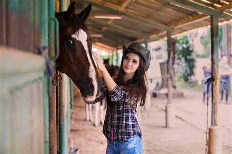 Premium Photo | Beautiful cowboy girl and horse at ranch