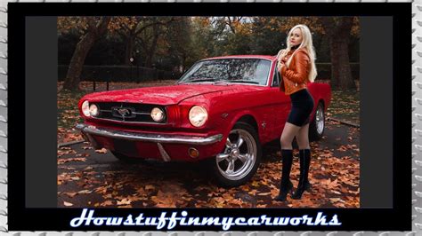 Beautiful Blonde Posing Next To Restored Red Vintage Ford Mustang Wearing Black Mini Skirt