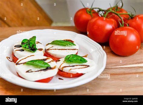 Tomatoes On The Vine Solanum Lycopersicum Red Tomato Basil