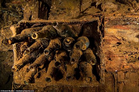 Japan's underwater graveyard: Incredible pictures of sunken planes, tanks and submarines show ...