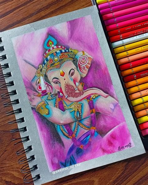 colored pencils are next to a drawing of an elephant with a crown on ...