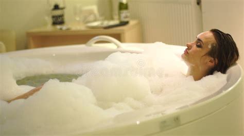 Woman Bathing In Milk Bath Filled With Fruit Relax Spa And Skin Care