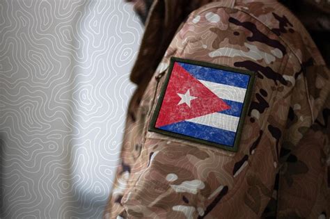 Premium Photo | Cuba soldier soldier with flag cuba cuba flag on a ...