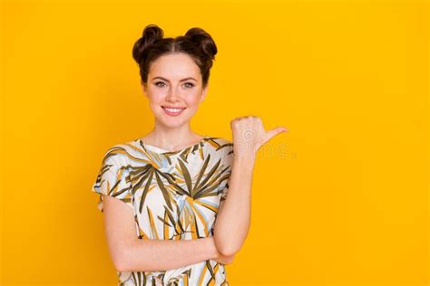 Photo Of Pretty Lovely Woman Wear Print T Shirt Pointing Thumb Up Empty Space Isolated Yellow