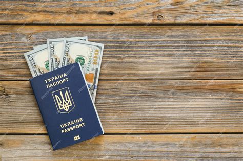 Premium Photo Biometric Ukrainian Passport And Money On A Wooden