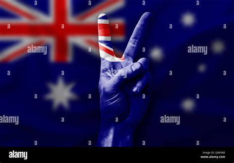 Hand Making The V Victory Sign With Flag Of Australia Stock Photo Alamy