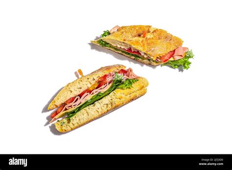 Panini Sandwich With Ham Crispy Salad And Vegetables Isolated On White