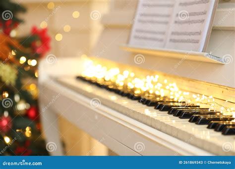 White Piano with Festive Decor and Note Sheets Indoors. Christmas Music ...