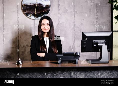 Portrait Of Receptionist At Desk In Lobby Banner Design Friendly