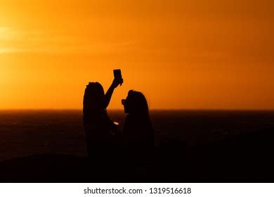 Sunset Silhouette Same Sex Couple Girls Stock Photo 1319516618 Shutterstock
