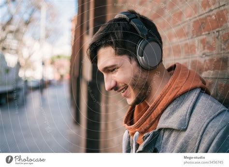 People Listening To Music With Headphones