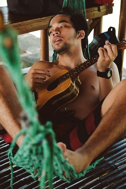 Premium Photo Shirtless Man Playing Guitar