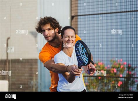 Young Teacher Is Monitoring Teaching Padel Lesson To His Student