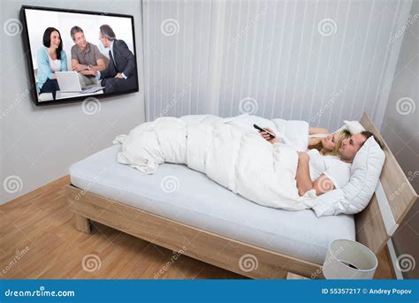 Couple In Bed Watching Television Stock Image Image Of Male Luxury