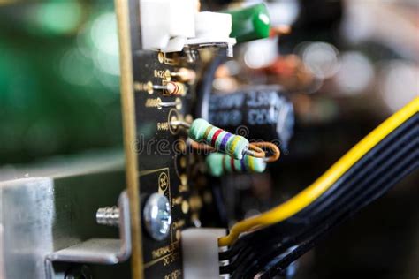 A Portrait Of Some Resistors On A Black Circuit Board In An Open