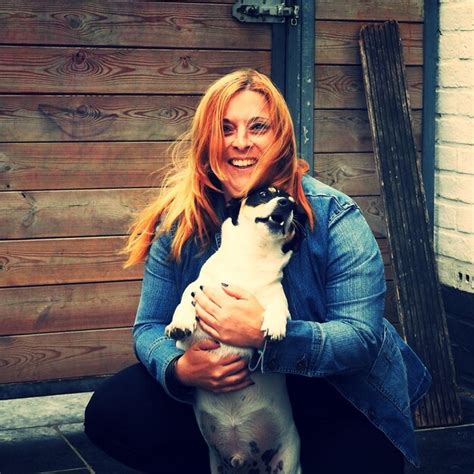 Premium Photo Portrait Of A Smiling Young Woman Holding Dog