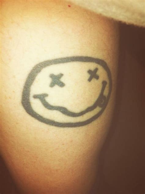 Nirvana Smiley Face Logo Tattoo