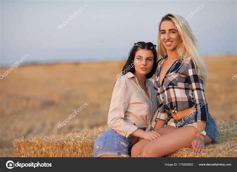 Two Happy Girl On The Hay Sexy Brunette And Blonde Women In Field