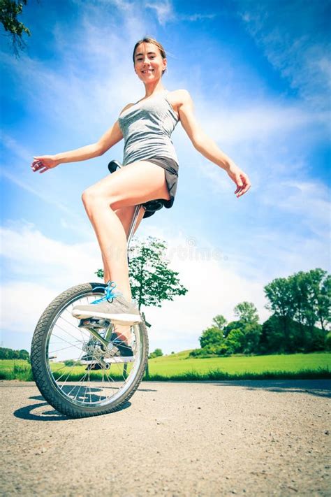 Young Woman Riding Her Unicycle Stock Image Image Of Season Colors