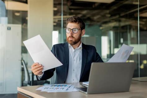 Premium Photo Shocked Mature Businessman Reading Documents Having Problem With Reports Working
