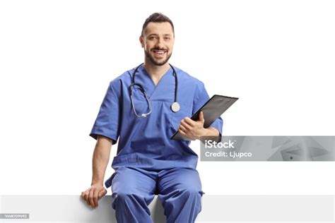 Helath Care Worker In A Blue Uniform Sitting On A Blank Panel Stock ...