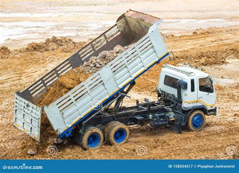 Big Dump Truck Working Delivery Of Sand To The Construction Site And