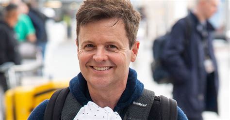 Dec Donnelly all smiles carrying baby son Jack as he heads to Australia for I'm A Celeb - Mirror ...